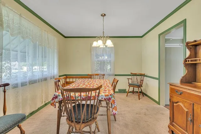 a very nice looking dining room with a table and chairs