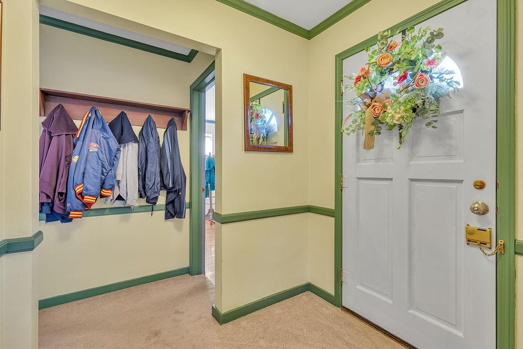 4178 South R 1022 New Brighton, PA 15066 - Photo 18 of 33 a view of a hallway with painting on the wall and a potted plant