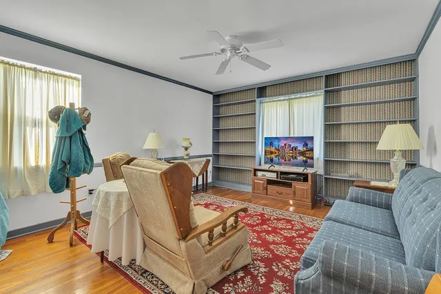 a living room with furniture and a rug