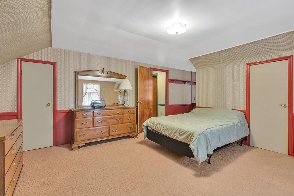 4178 South R 1022 New Brighton, PA 15066 - Photo 24 of 33 a spacious bedroom with a large bed and dresser with mirror