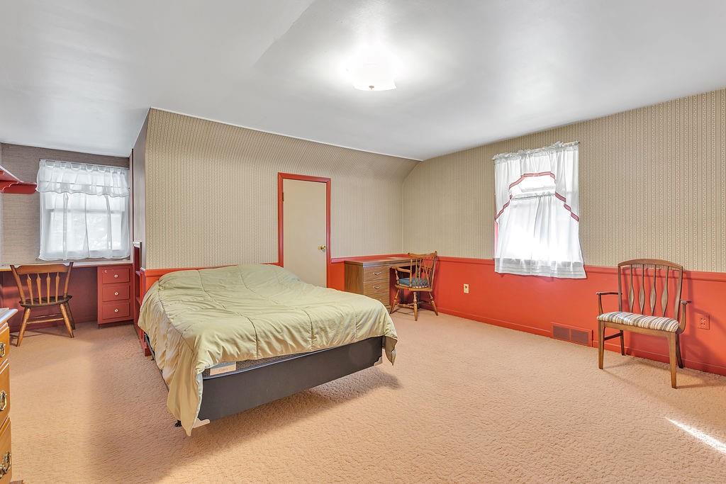 4178 South R 1022 New Brighton, PA 15066 - Photo 25 of 33 a spacious bedroom with a bed and a couch