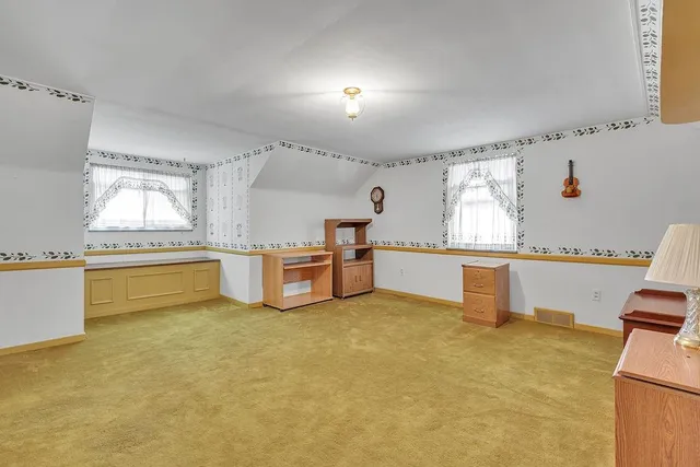 a kitchen with stainless steel appliances granite countertop a sink and a refrigerator