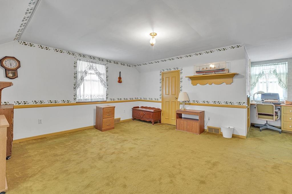4178 South R 1022 New Brighton, PA 15066 - Photo 27 of 33 a kitchen with stainless steel appliances granite countertop a sink and a refrigerator