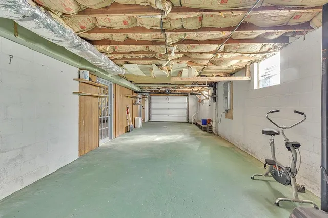 a picture of a bathroom with a white wall