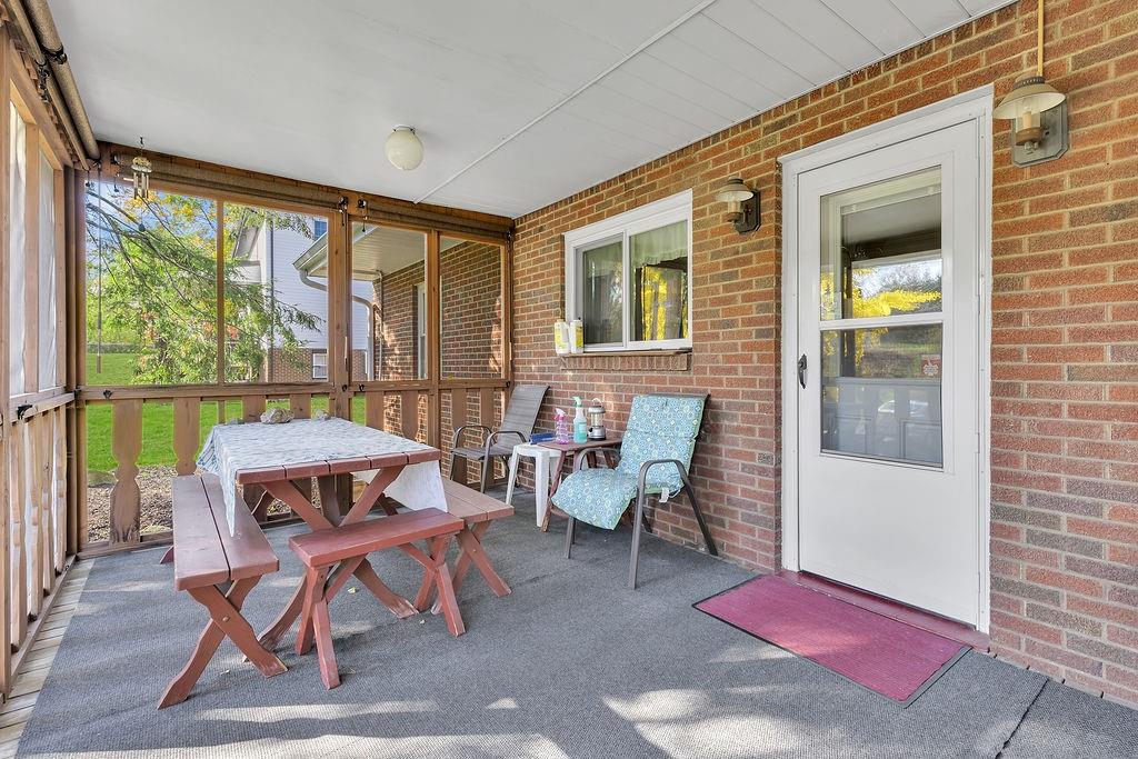 4178 South R 1022 New Brighton, PA 15066 - Photo 7 of 33 a living room with furniture a rug and a large window