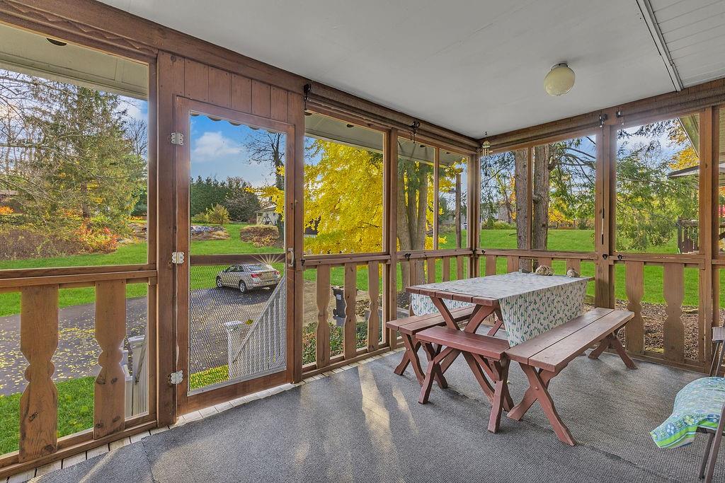 4178 South R 1022 New Brighton, PA 15066 - Photo 8 of 33 a living room with furniture and a floor to ceiling window