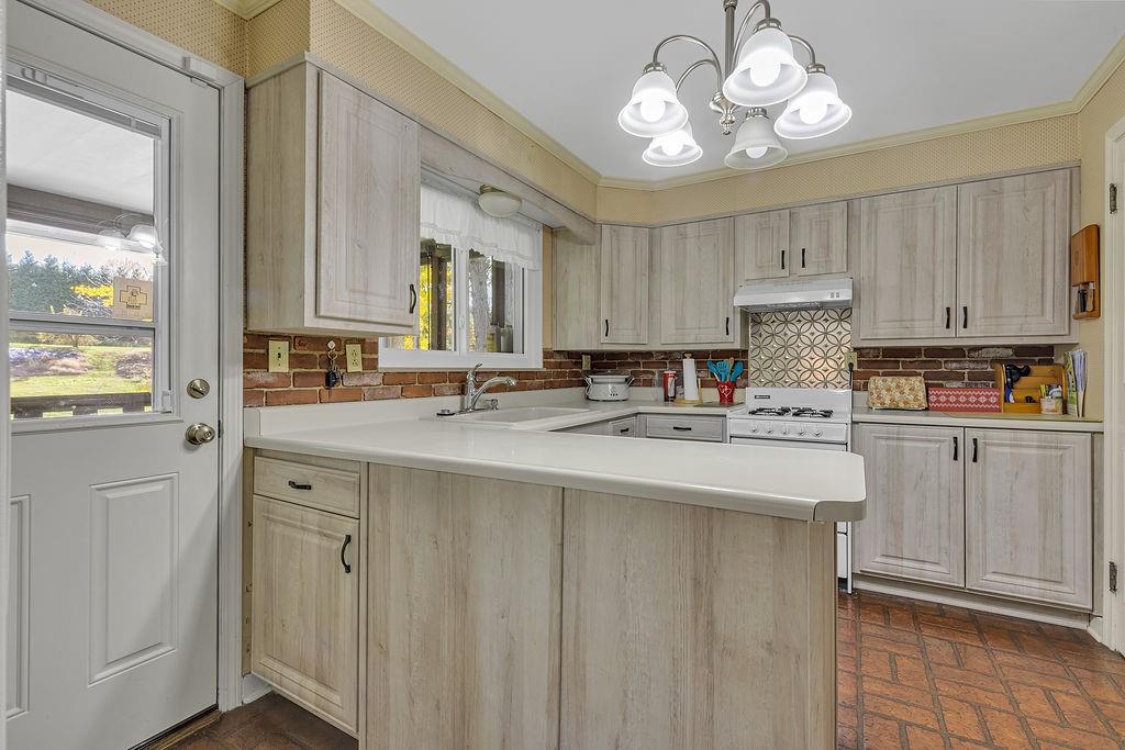 4178 South R 1022 New Brighton, PA 15066 - Photo 9 of 33 a kitchen with kitchen island granite countertop a sink window and cabinets