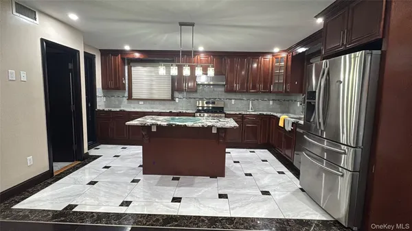 a large white kitchen with a large window