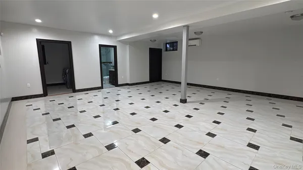 a large white bathroom with shower