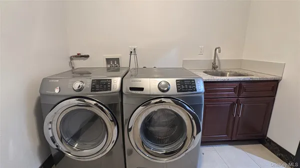 a view of washer and dryer in a utility room