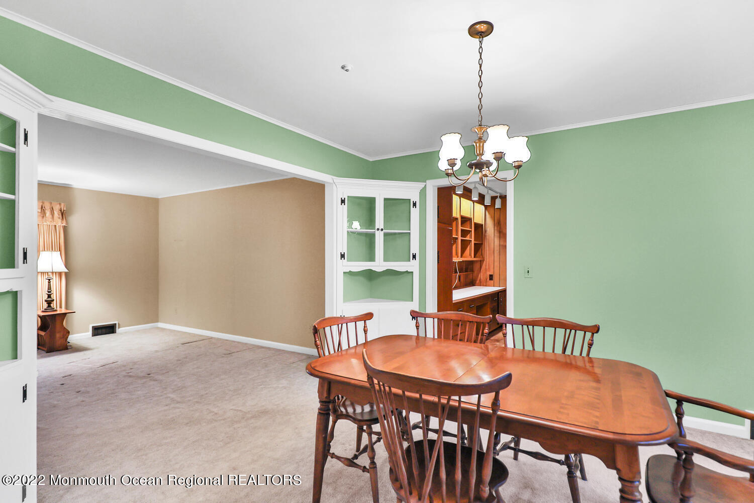 43 Ramon Boulevard Freehold, NJ 07728 - Photo 8 of 40 a dining room with furniture potted plants and a chandelier