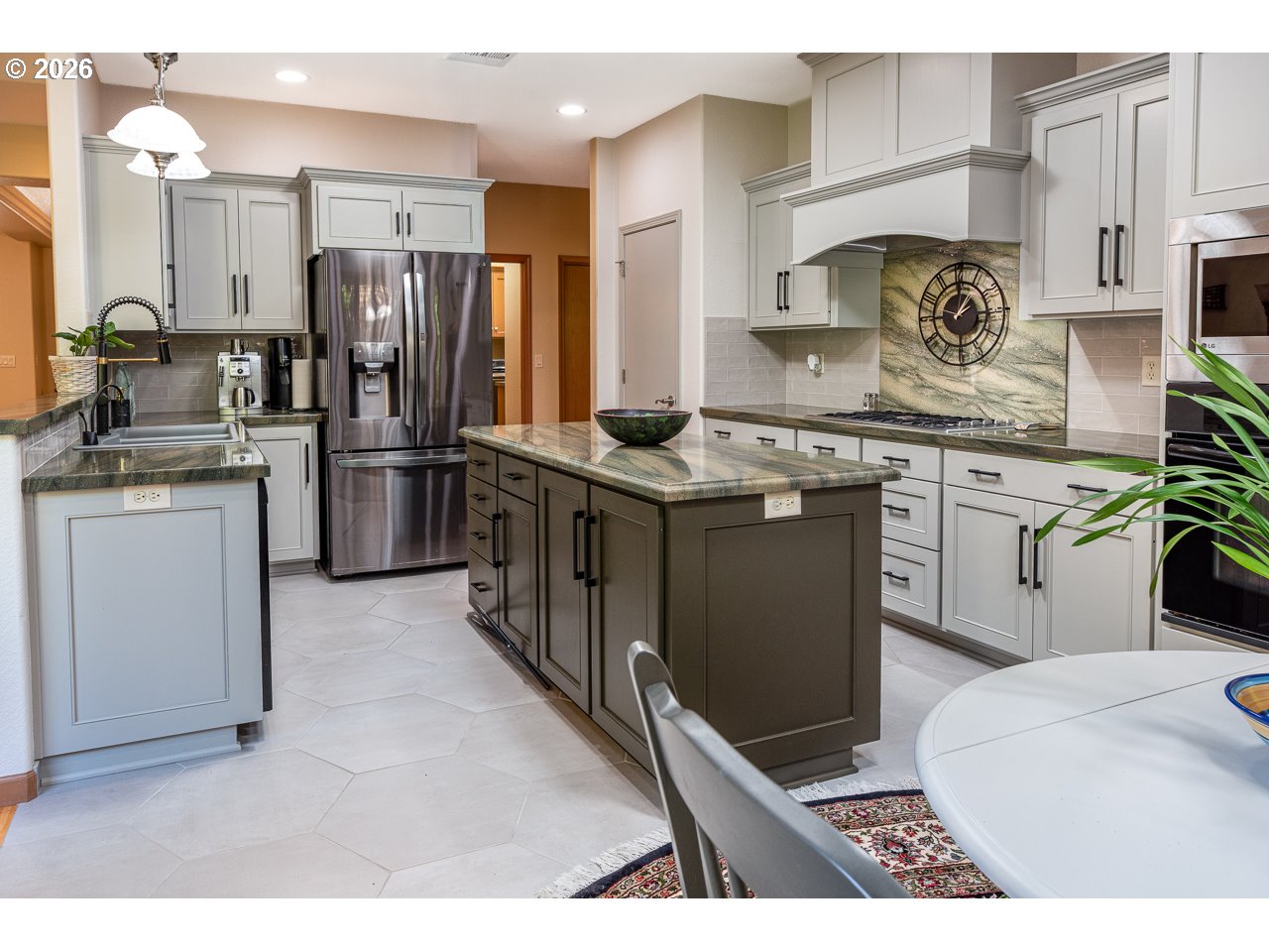 3381 Rosemont Way Eugene, OR 97401 - Photo 14 of 45 a kitchen with stainless steel appliances granite countertop a stove top oven a refrigerator a sink and dishwasher