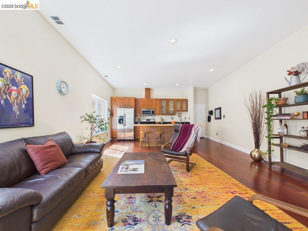 1488 14th Street, Unit A Oakland, CA 94607 - Photo 19 of 36 a living room with furniture and wooden floor