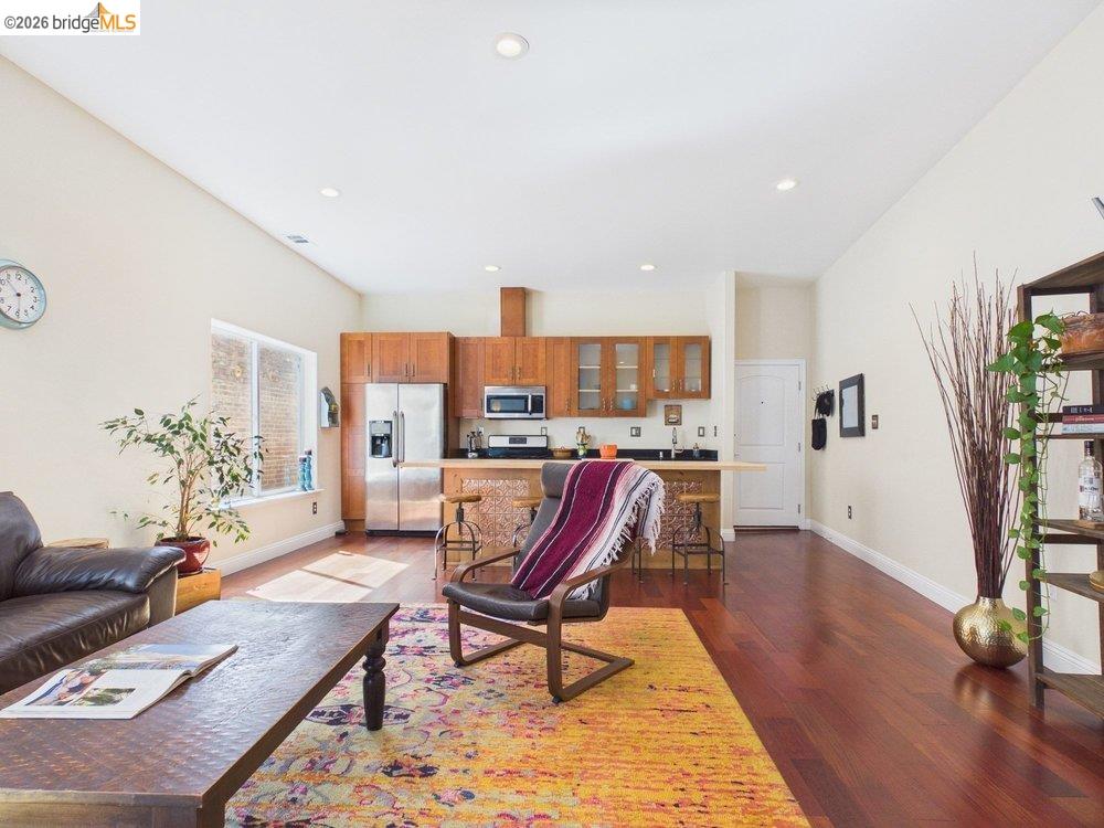 1488 14th Street, Unit A Oakland, CA 94607 - Photo 2 of 36 a living room with furniture and a wooden floor