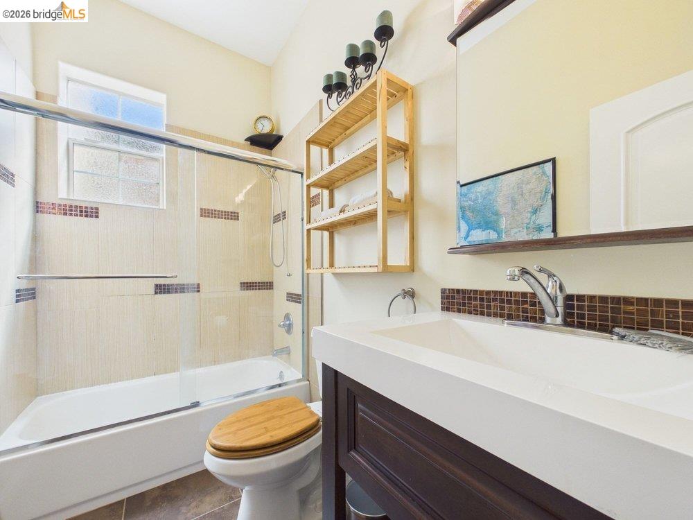 1488 14th Street, Unit A Oakland, CA 94607 - Photo 27 of 36 a bathroom with a sink a toilet and a bathtub