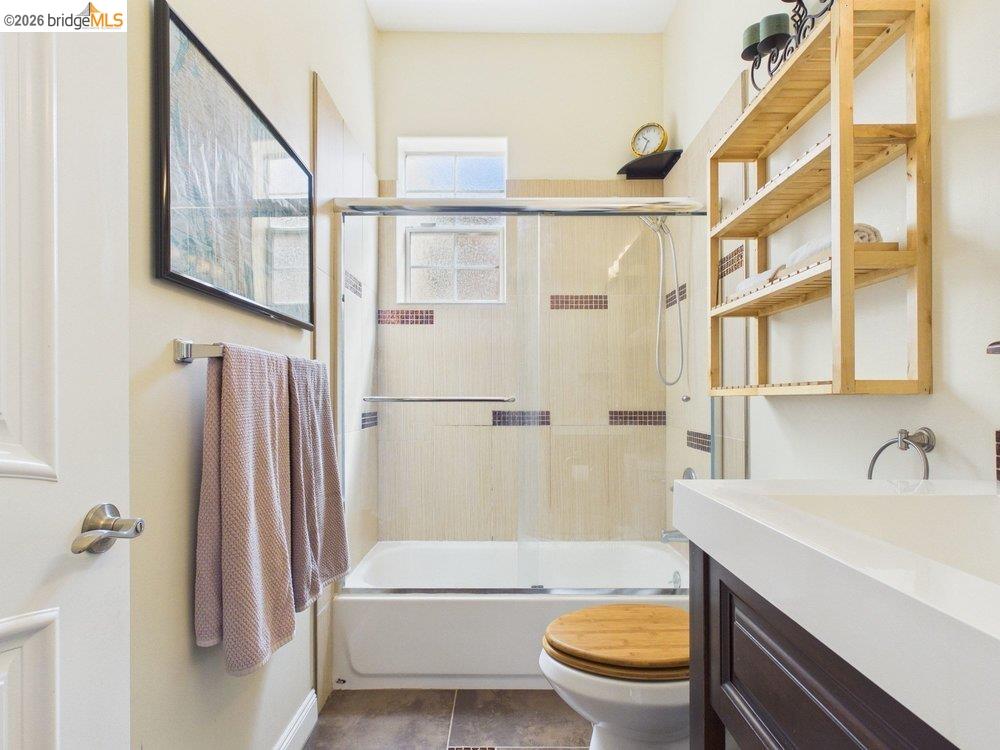 1488 14th Street, Unit A Oakland, CA 94607 - Photo 28 of 36 a bathroom with a sink a toilet and a bathtub