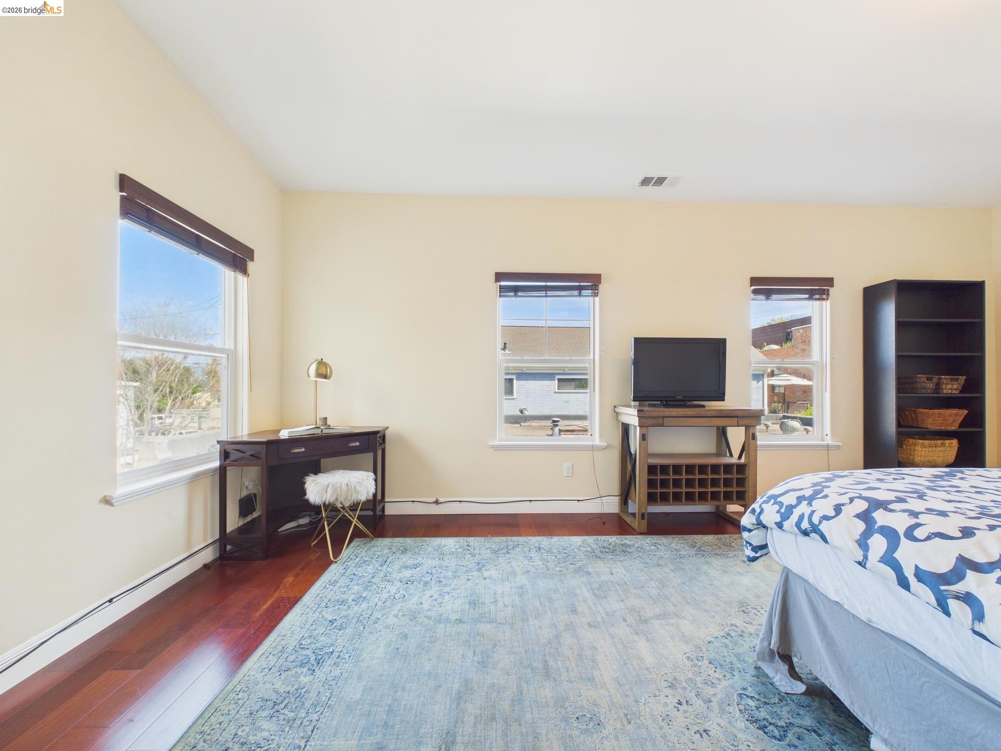 1488 14th Street, Unit A Oakland, CA 94607 - Photo 29 of 36 a living room with furniture and a flat screen tv