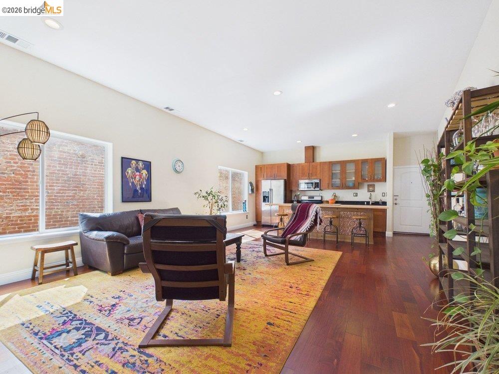 1488 14th Street, Unit A Oakland, CA 94607 - Photo 3 of 36 a living room with furniture and wooden floor