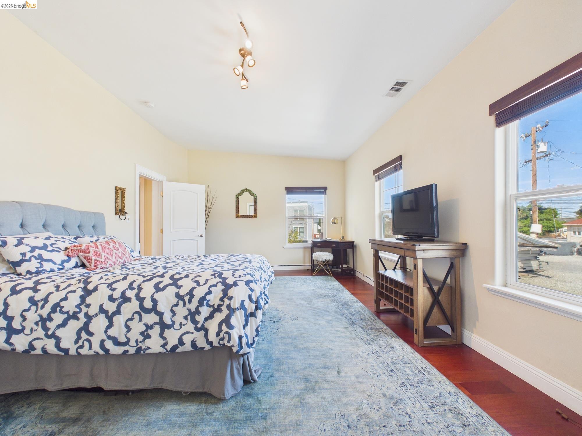 1488 14th Street, Unit A Oakland, CA 94607 - Photo 31 of 36 a living room with furniture and a flat screen tv