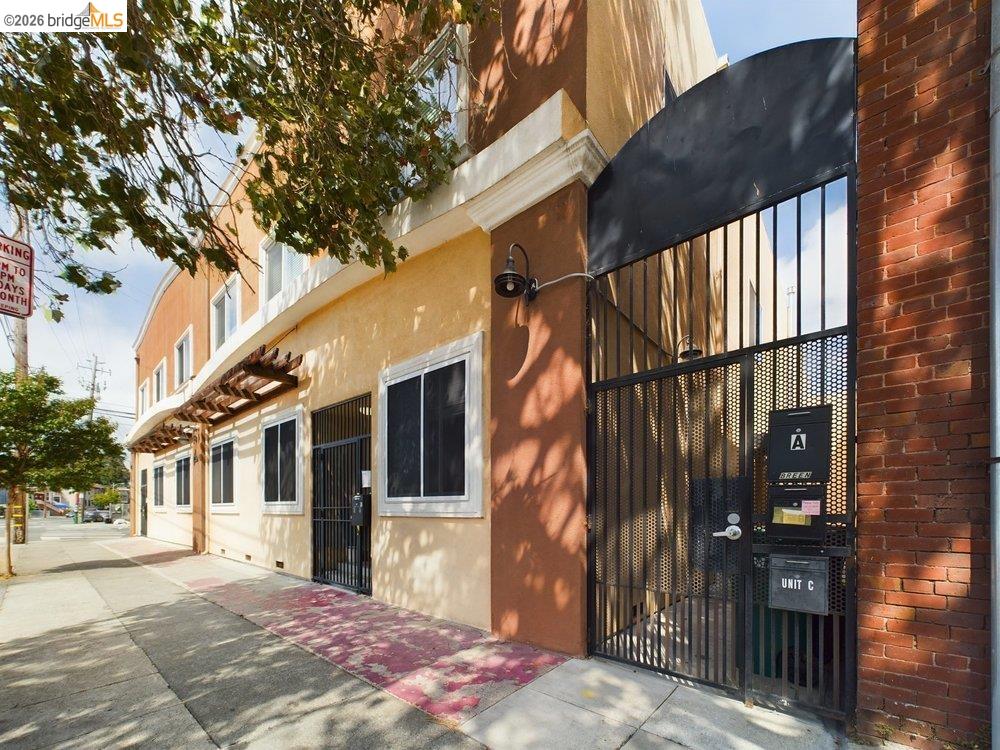 1488 14th Street, Unit A Oakland, CA 94607 - Photo 35 of 36 a front view of a house with a yard