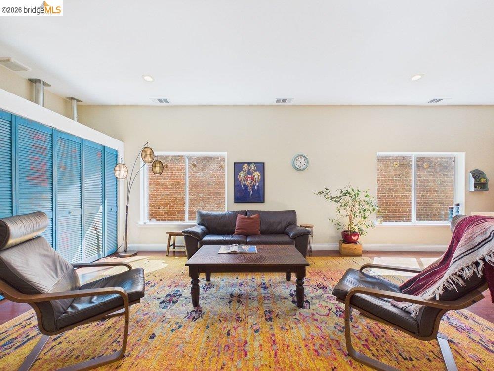 1488 14th Street, Unit A Oakland, CA 94607 - Photo 4 of 36 a living room with furniture and a rug