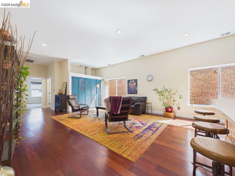 1488 14th Street, Unit A Oakland, CA 94607 - Photo 10 of 36 a living room with furniture and wooden floor