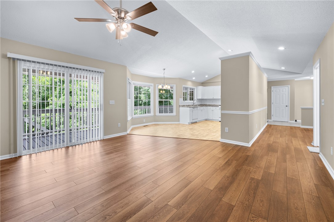 429 Burns Mill Road West Union, SC 29696 - Photo 9 of 49 An open concept design, this residence features a bright living area, hardwood floors, and sliding glass doors leading to an outdoor deck.