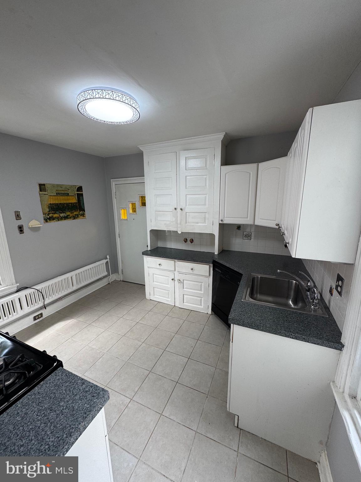 976 Upper Gulph Road Wayne, PA 19087 - Photo 3 of 12 a kitchen with a sink a stove and cabinets