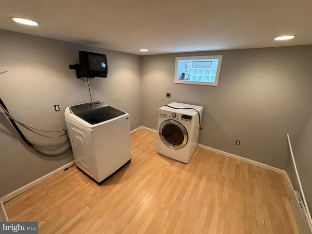 a view of kitchen and sink with wooden floor