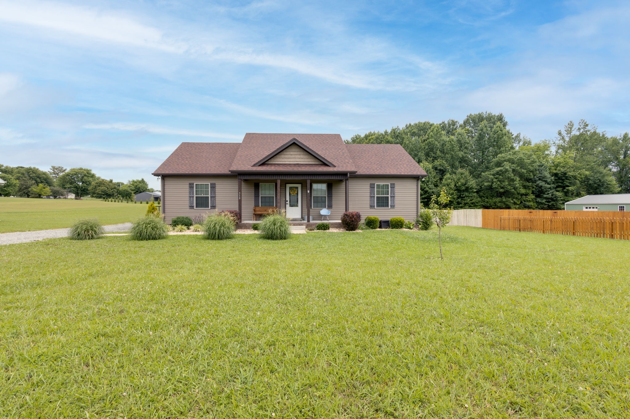 330 Tom Ferrell Road Portland, TN 37148 - Photo 1 of 29 a front view of a house with swimming pool having outdoor seating