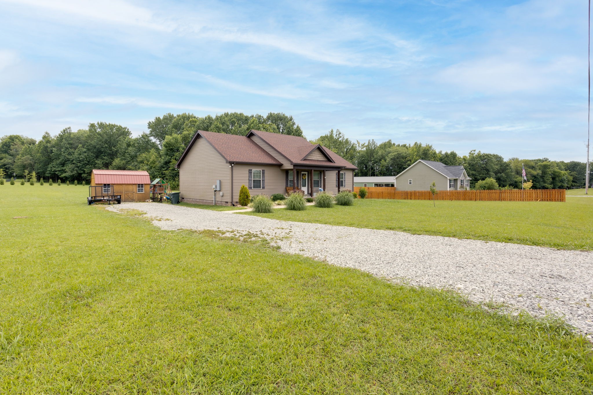330 Tom Ferrell Road Portland, TN 37148 - Photo 2 of 29 a house with garden in front of it
