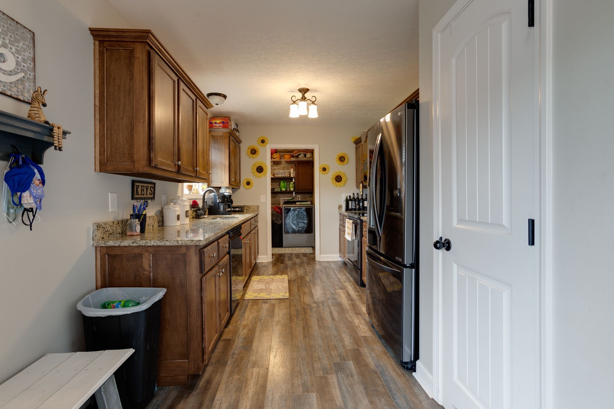 330 Tom Ferrell Road Portland, TN 37148 - Photo 11 of 29 a kitchen with stainless steel appliances granite countertop a refrigerator a stove and a wooden floors