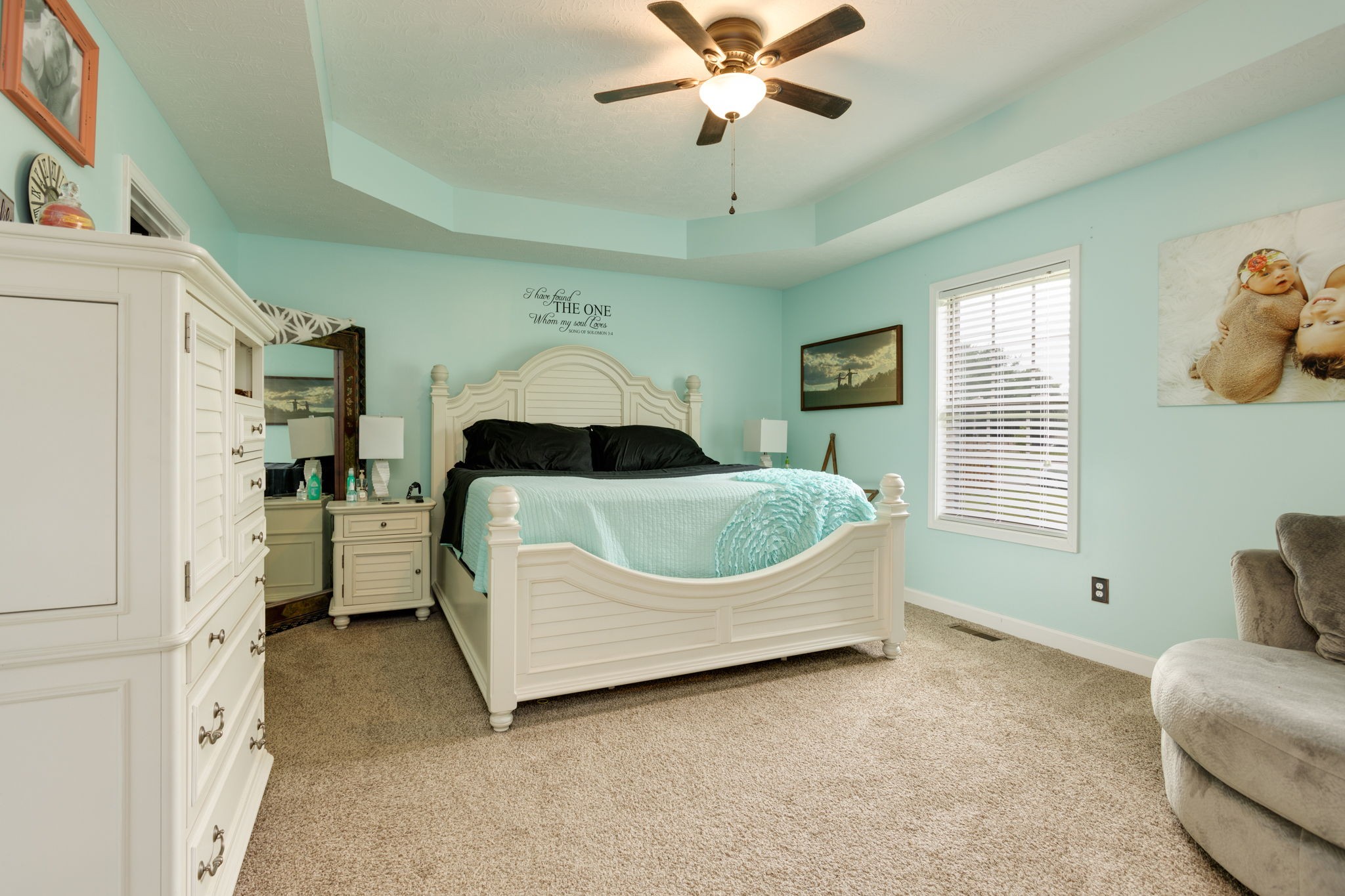 330 Tom Ferrell Road Portland, TN 37148 - Photo 16 of 29 a bedroom with a bed and a chandelier