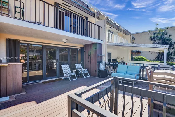a view of a swimming pool with outdoor seating