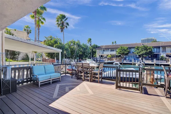 a view of a swimming pool with outdoor seating