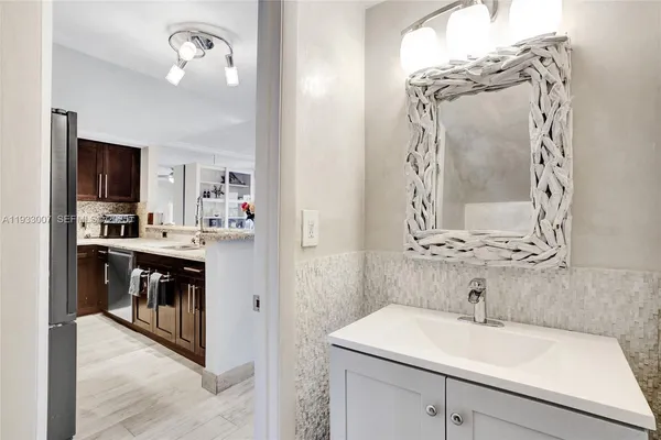 a en suite bathroom with a sink and a mirror