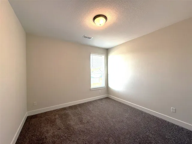 a bathroom with a double vanity sink and mirror with shower