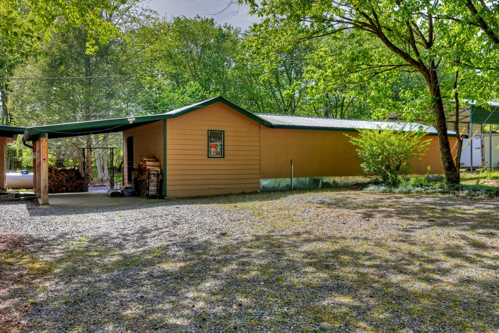 111 Candlewood Lane Blue Ridge, GA 30513 - Photo 18 of 57 a house with a yard