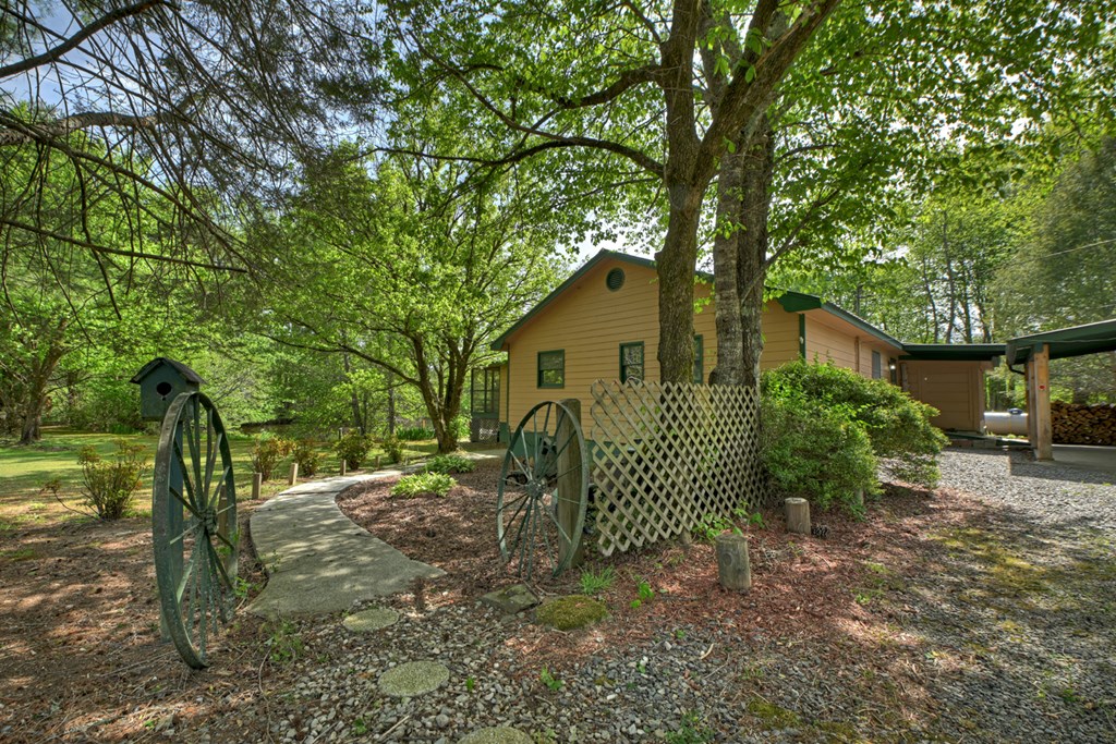 111 Candlewood Lane Blue Ridge, GA 30513 - Photo 25 of 57 a view of a house with a yard and plants