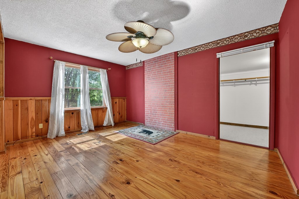 111 Candlewood Lane Blue Ridge, GA 30513 - Photo 40 of 57 a view of empty room with wooden floor and fan