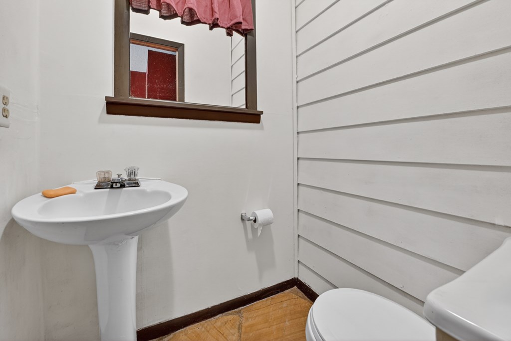 111 Candlewood Lane Blue Ridge, GA 30513 - Photo 41 of 57 a bathroom with a sink a toilet and mirror