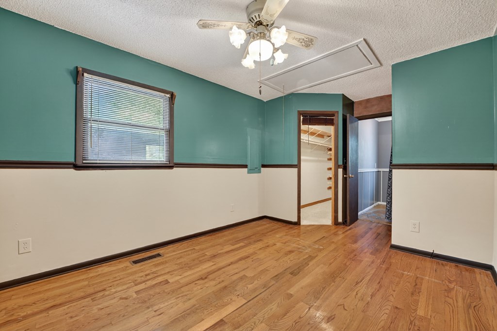 111 Candlewood Lane Blue Ridge, GA 30513 - Photo 50 of 57 a view of a livingroom with wooden floor and a ceiling fan