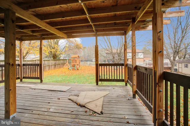 a view of a balcony with wooden floor