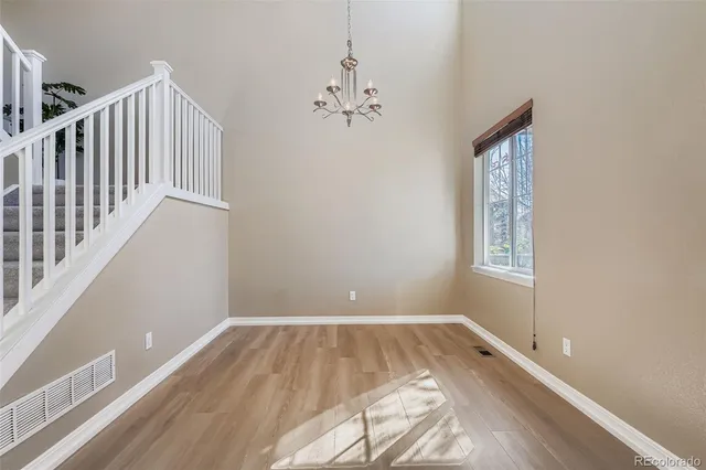 a view of room with window and hardwood floor