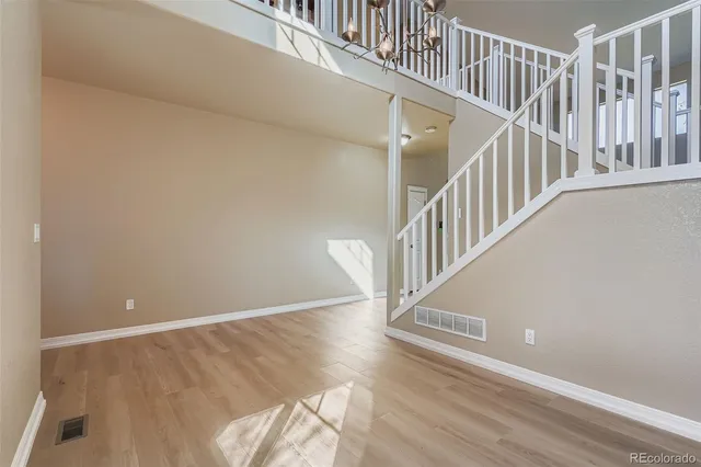 a view of entryway with wooden floor