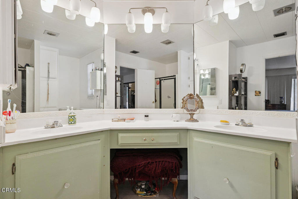 1550 Rory Lane, Unit 82 Simi Valley, CA 93063 - Photo 20 of 27 a bathroom with a sink double vanity and a mirror