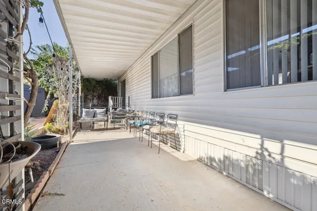 a view of a chairs and table in a patio