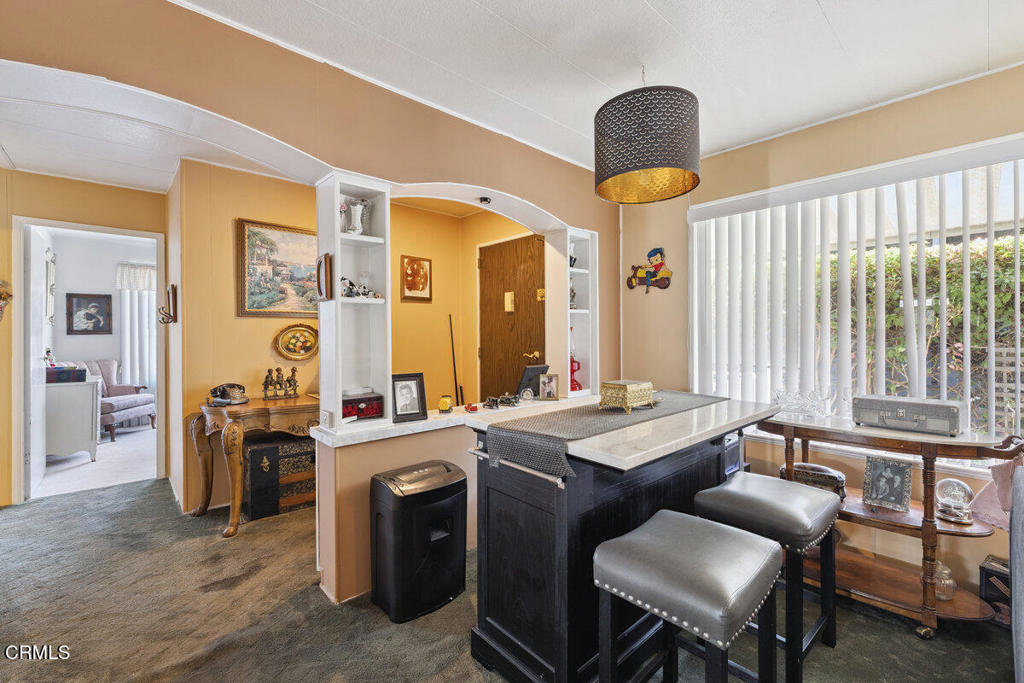 1550 Rory Lane, Unit 82 Simi Valley, CA 93063 - Photo 8 of 27 a kitchen that has a table and chairs in it