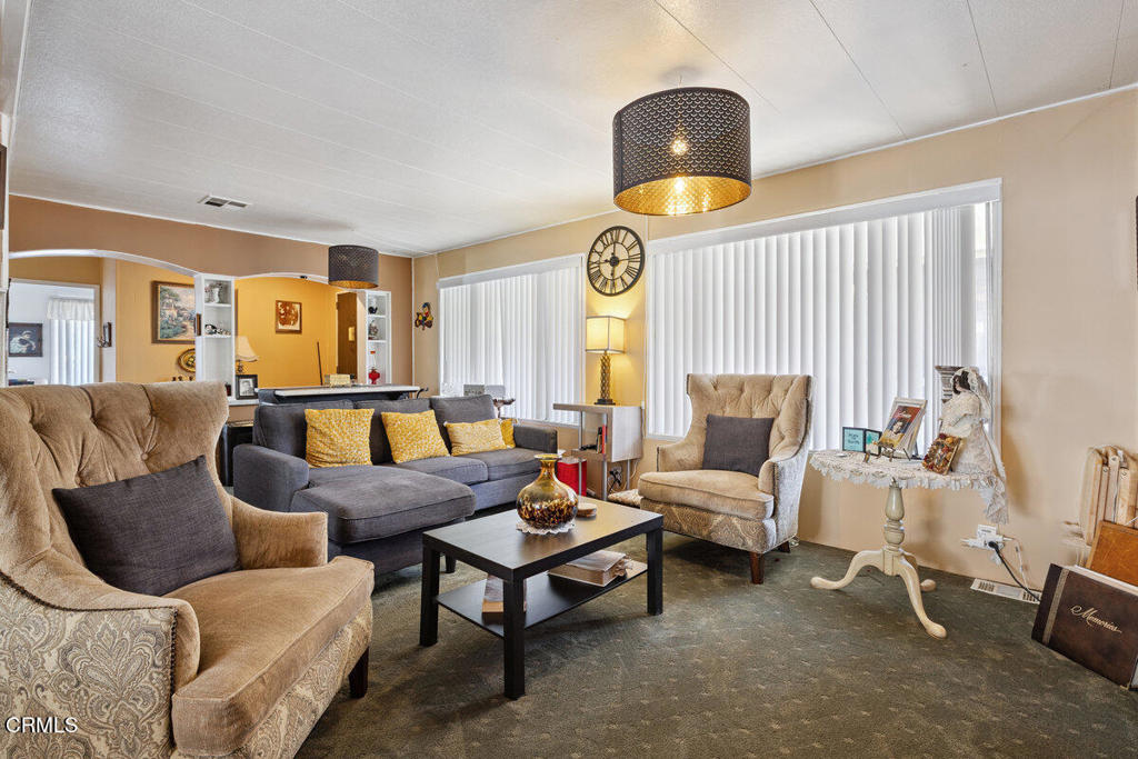 1550 Rory Lane, Unit 82 Simi Valley, CA 93063 - Photo 10 of 27 a living room with furniture and a large window