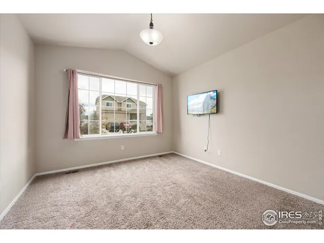 a view of a living room kitchen and a wooden floor